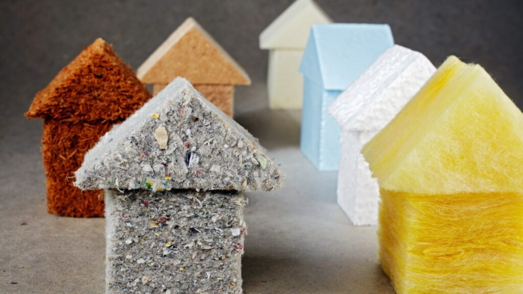 Small house models made from various insulation materials such as cork, wool, and styrofoam